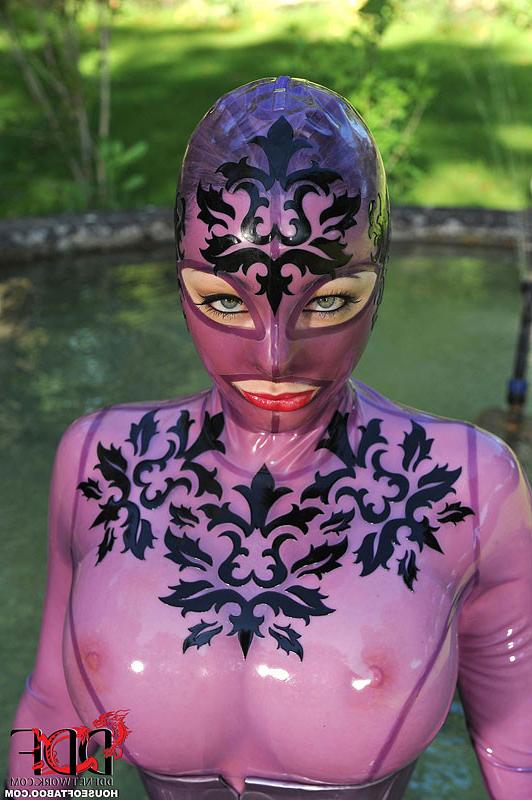 16P Latex Lucy babe in purple latex body suit gets her pussy plugged