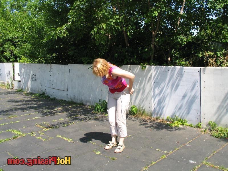 15P Slutty blond in the pants demonstrates her boobs after public pissing