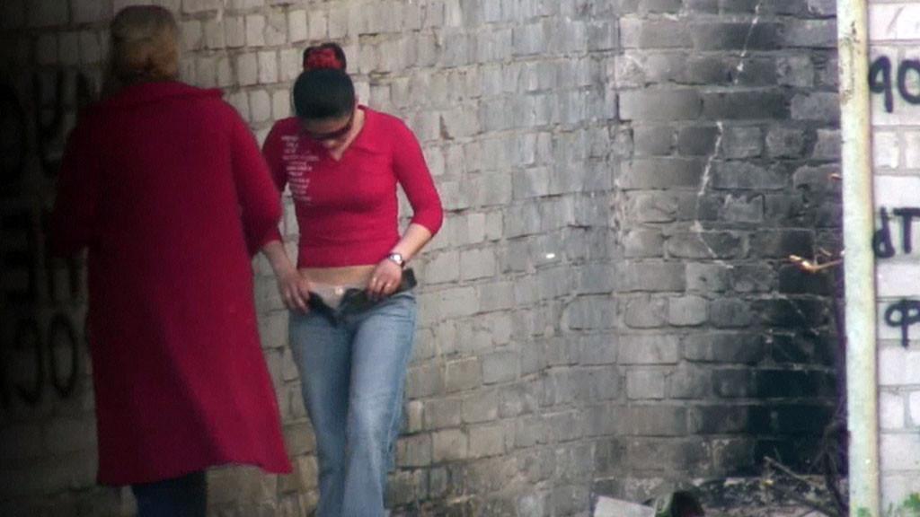 15P Hot girl with red hair filmed on the sly having a pee