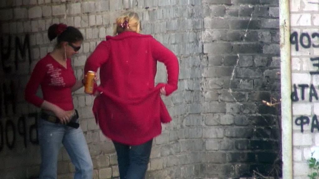 15P Hot girl with red hair filmed on the sly having a pee