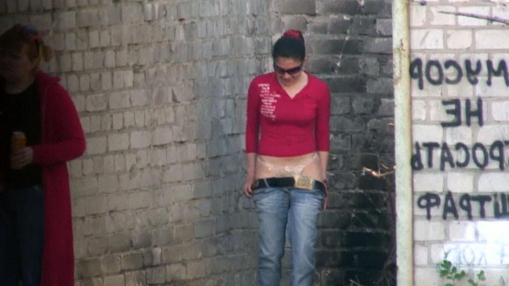 15P Hot girl with red hair filmed on the sly having a pee