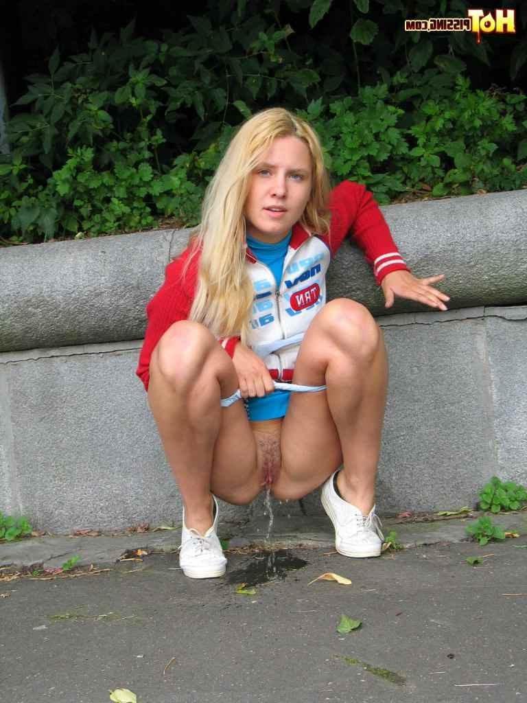 16P Cute blonde pissing in the street