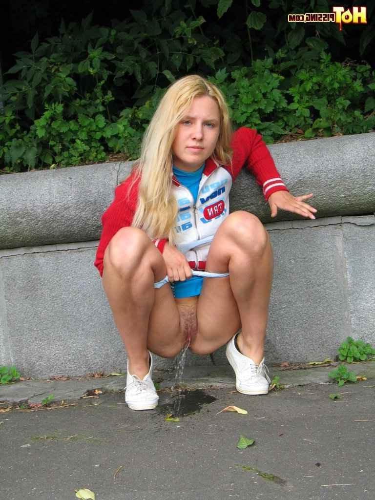 16P Cute blonde pissing in the street