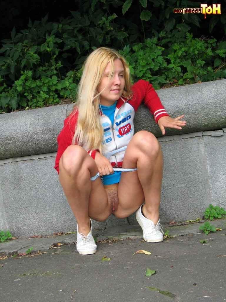 16P Cute blonde pissing in the street