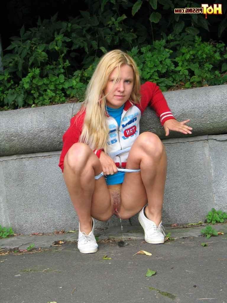 16P Cute blonde pissing in the street