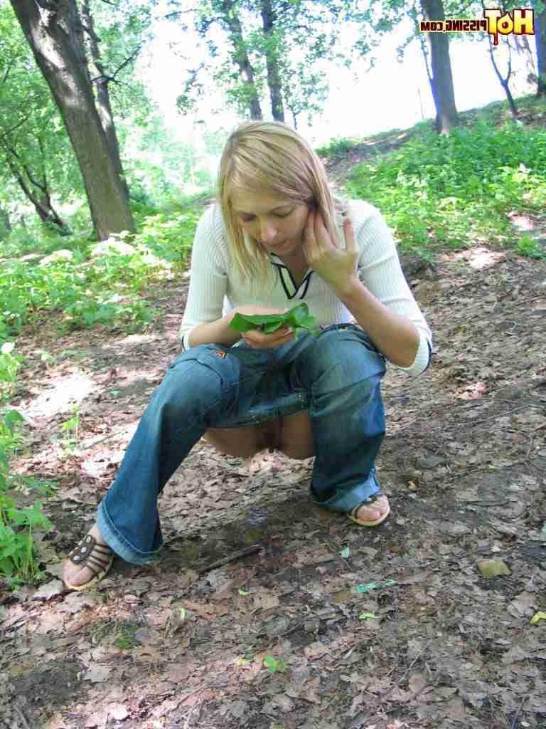 16P Slut pissing in the woods and using a leaf to wipe her pussy