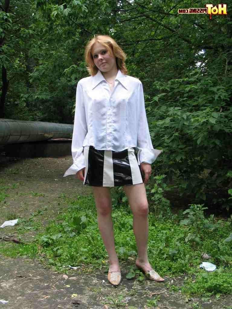 16P Cutie pissing outdoors
