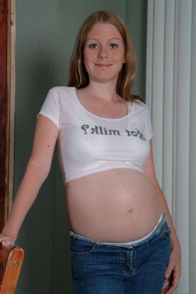 20P Strip teasing big tit prego loves rubbing dildo on her twat