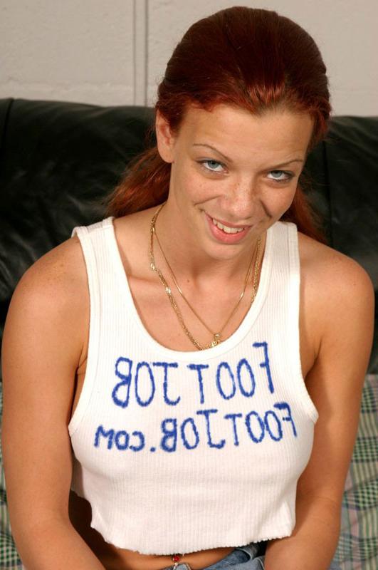 16P Sexy redhead with huge jugs rubbing him with her feet