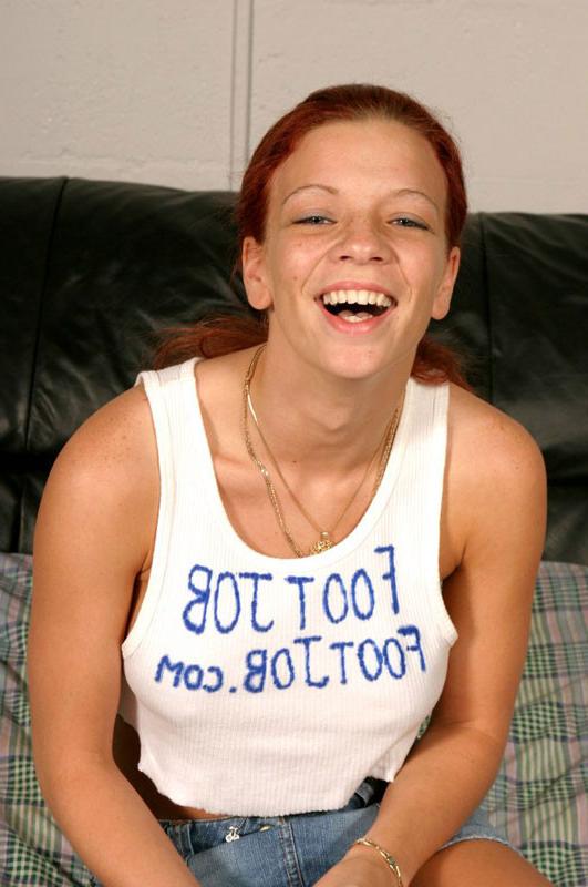16P Sexy redhead with huge jugs rubbing him with her feet