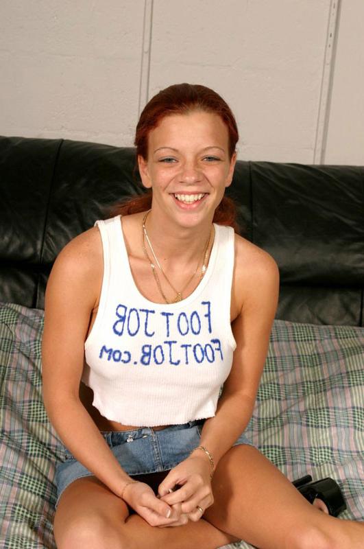 16P Sexy redhead with huge jugs rubbing him with her feet