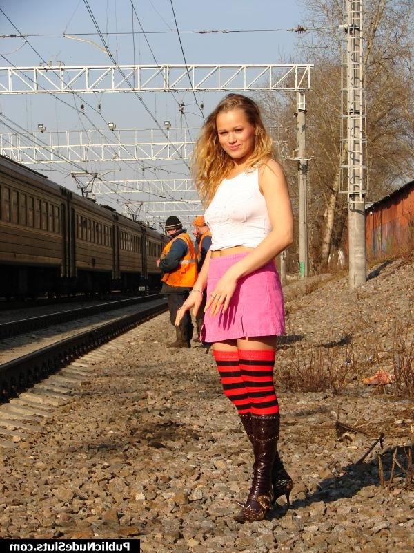 15P Adventure-hungry babe flashes her nude tits and butt at the railside