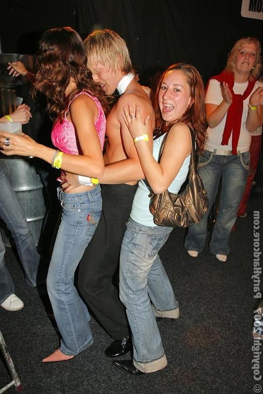 15P Horny brunette riding a man on the stage of orgy sex party