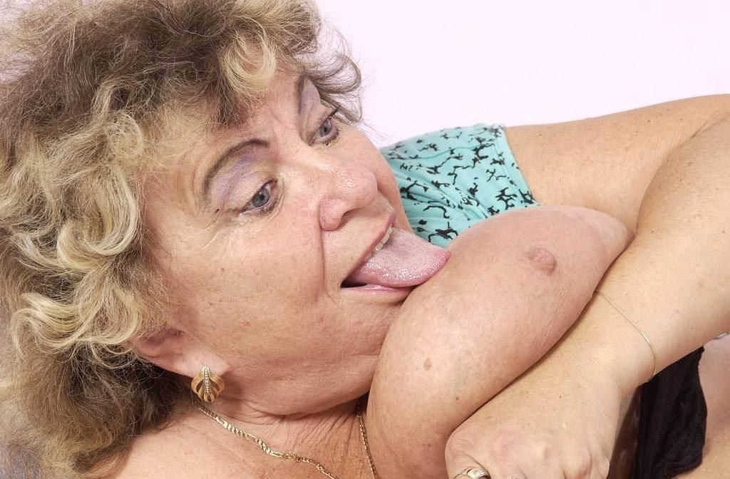 14P kinky granny playing with her huge tits