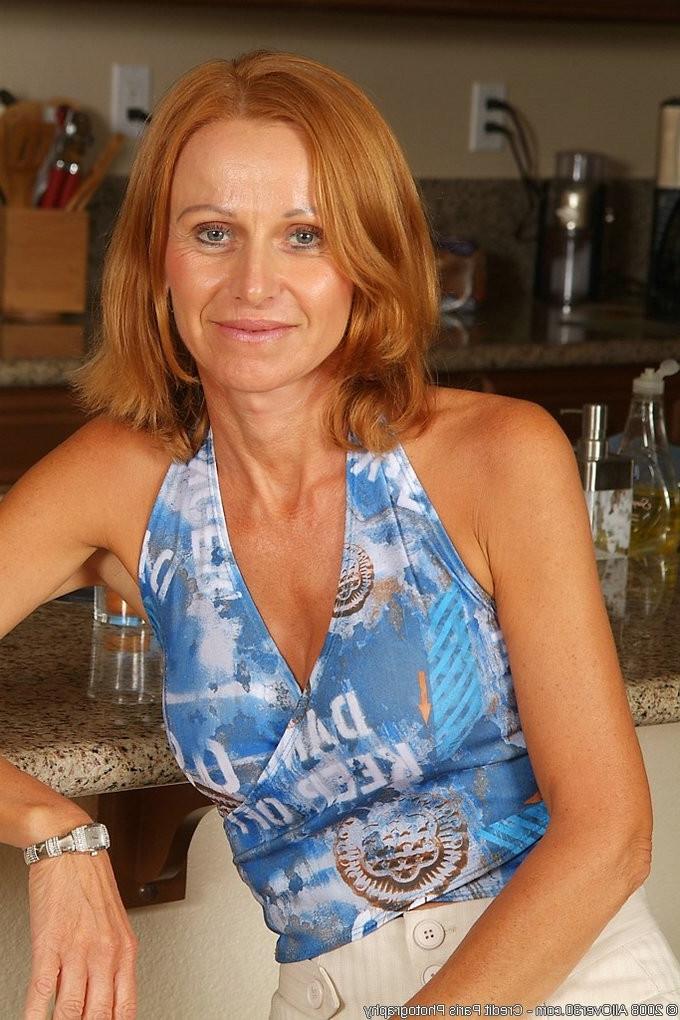 16P Redhead hairy granny spreading her pussy wide open