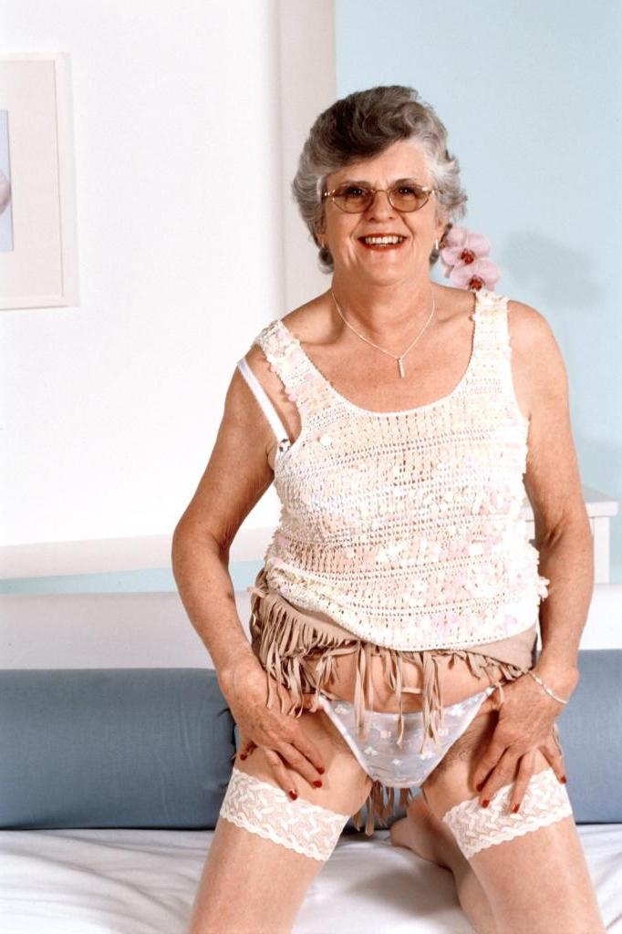 20P Granny in white stockings loves stuffing dildo in her twat