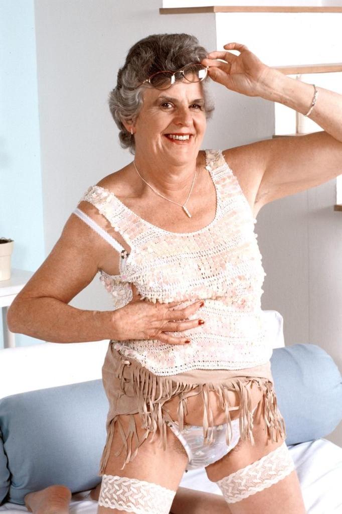 20P Granny in white stockings loves stuffing dildo in her twat