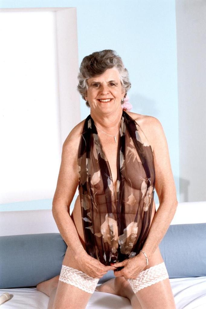 20P Granny in white stockings loves stuffing dildo in her twat