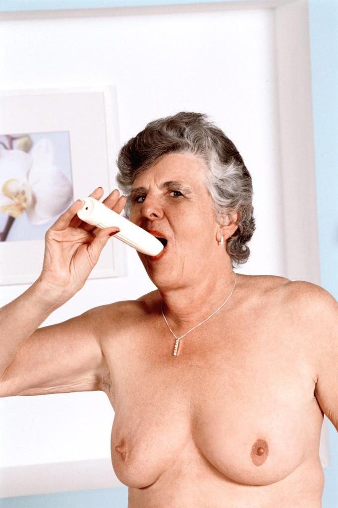 20P Granny in white stockings loves stuffing dildo in her twat