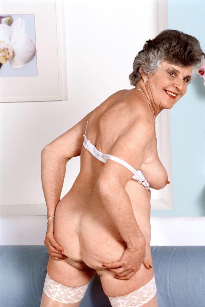 20P Granny in white stockings loves stuffing dildo in her twat