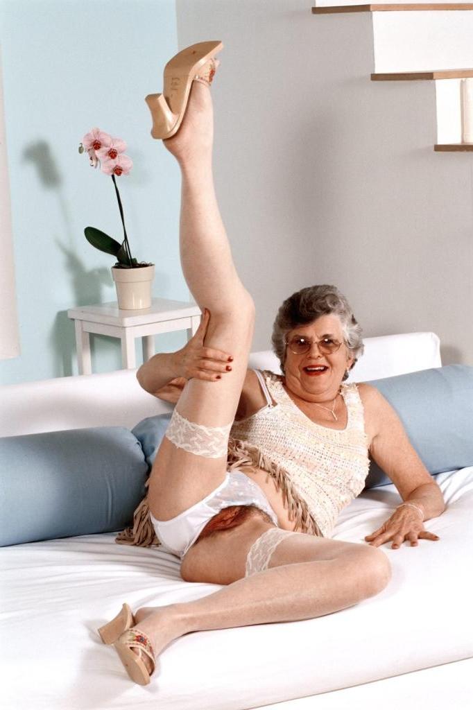 20P Granny in white stockings loves stuffing dildo in her twat
