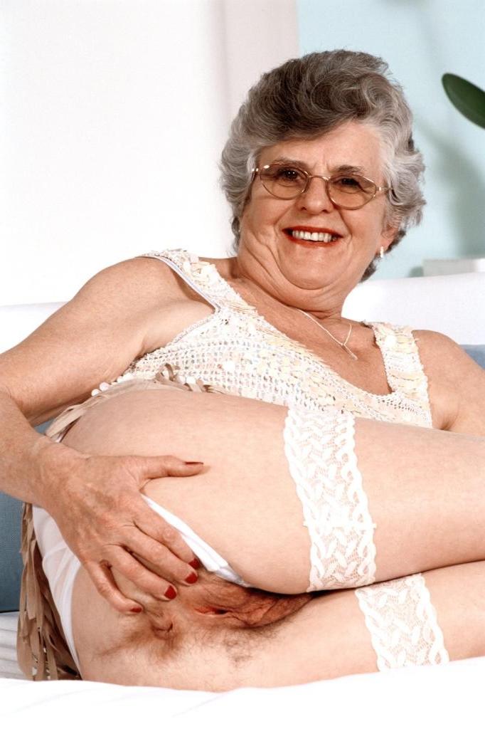 20P Granny in white stockings loves stuffing dildo in her twat