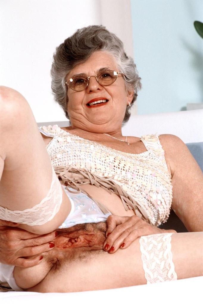 20P Granny in white stockings loves stuffing dildo in her twat