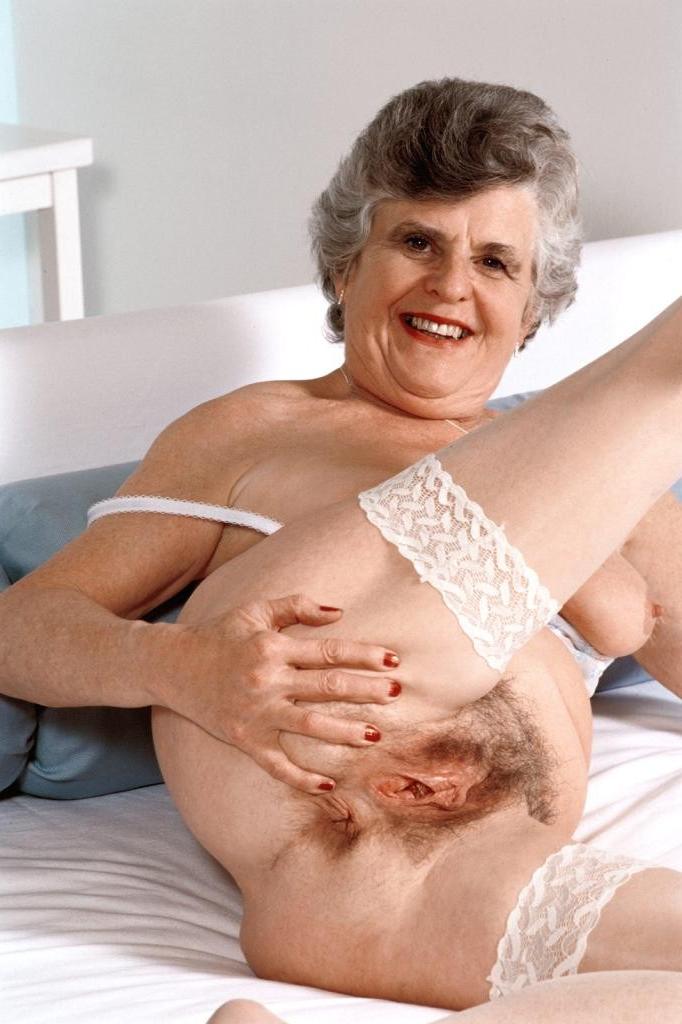 20P Granny in white stockings loves stuffing dildo in her twat