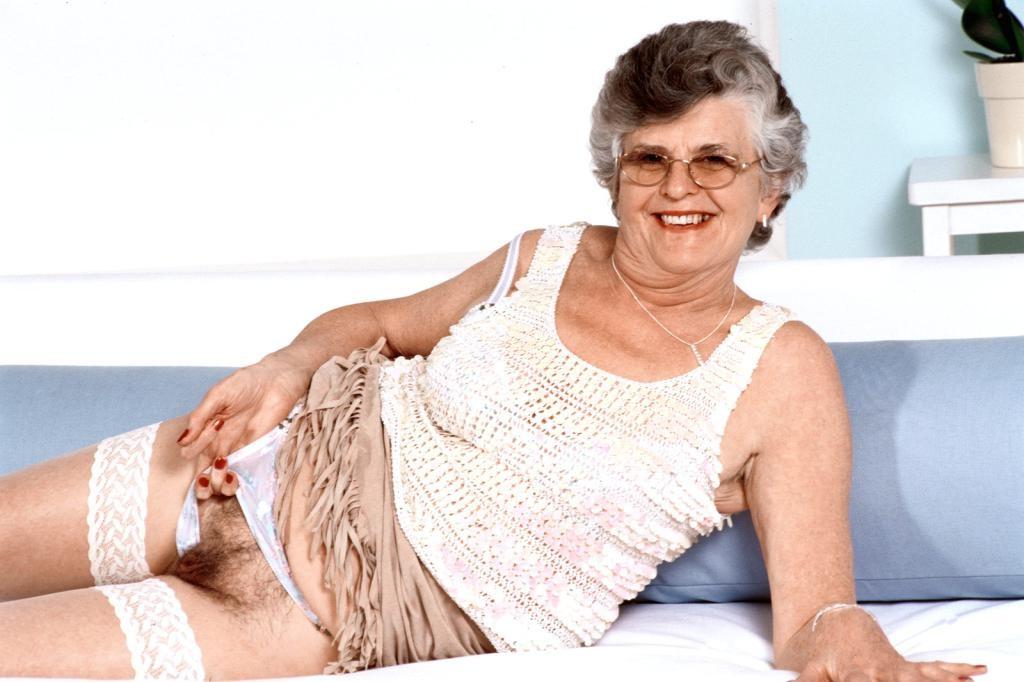 20P Teasing horny granny in white lingerie dildoing her pussy