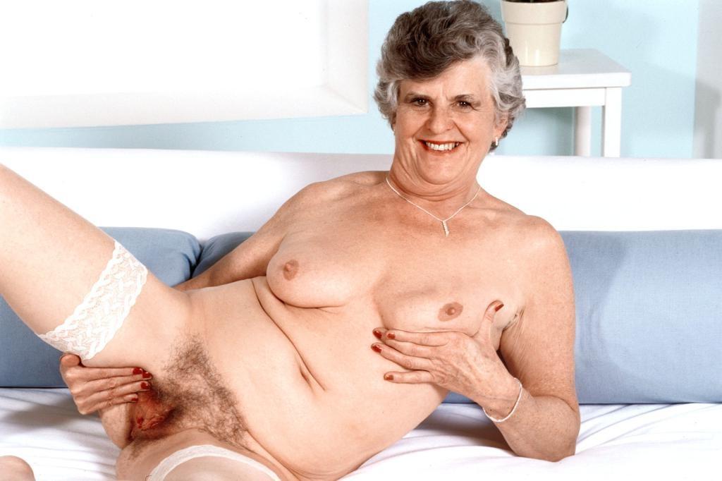20P Horny granny in stockings spreading her hairy pussy
