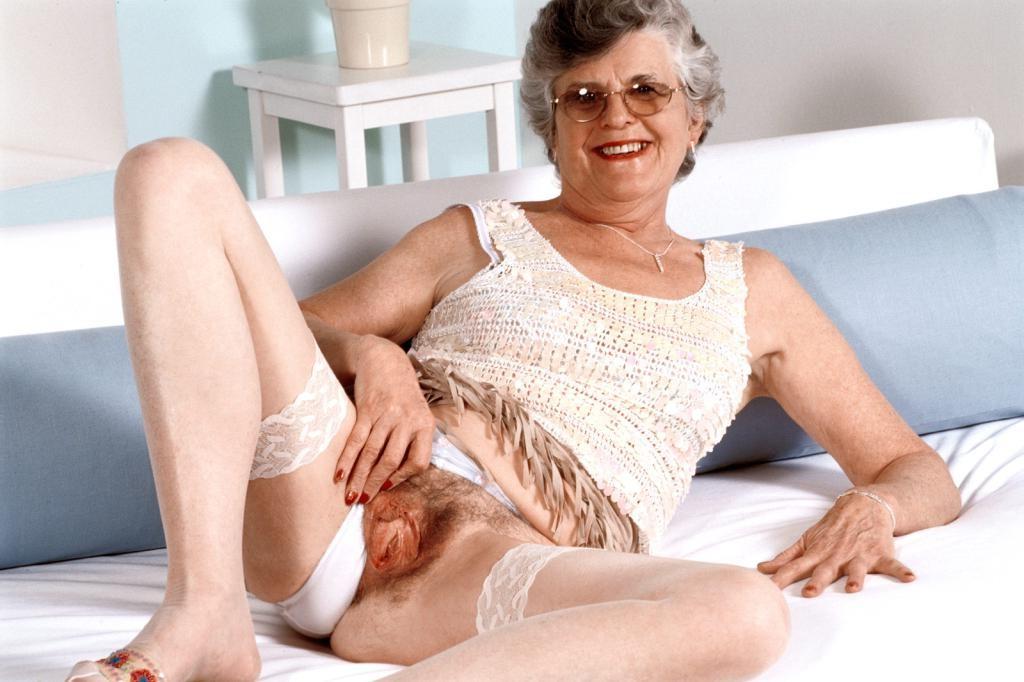 20P Horny granny in stockings spreading her hairy pussy