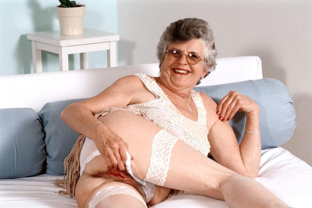 20P Horny granny in stockings spreading her hairy pussy