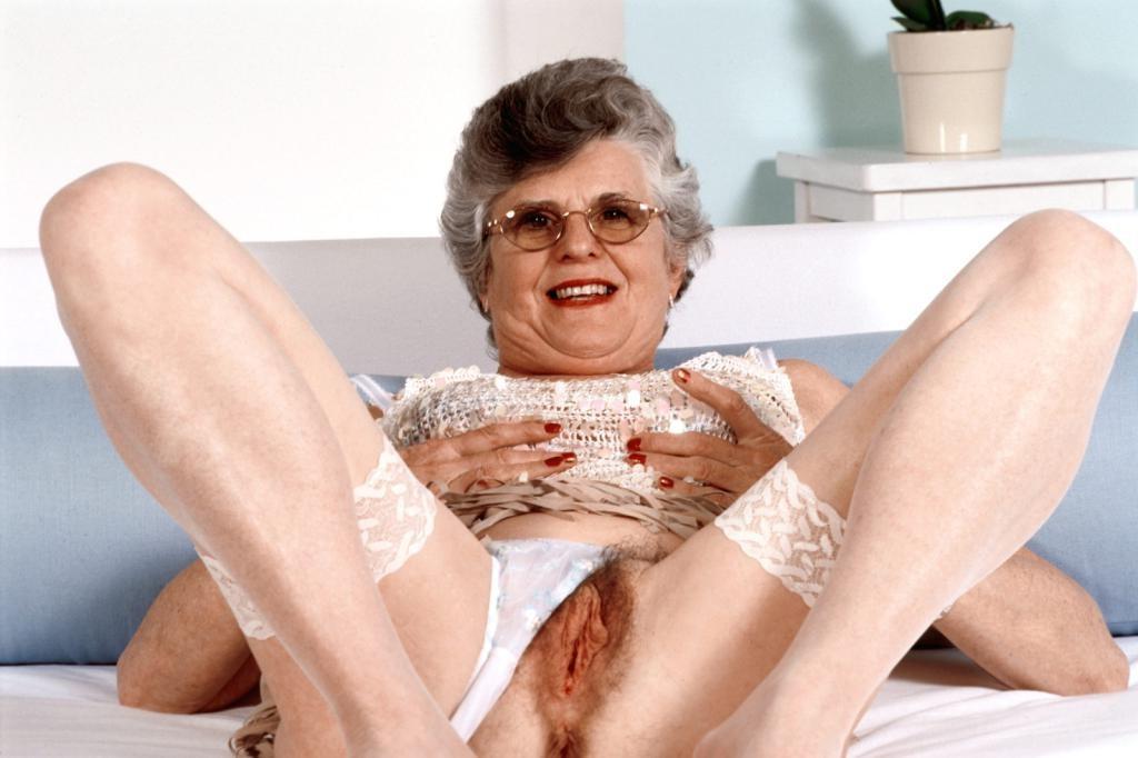 20P Horny granny in stockings spreading her hairy pussy