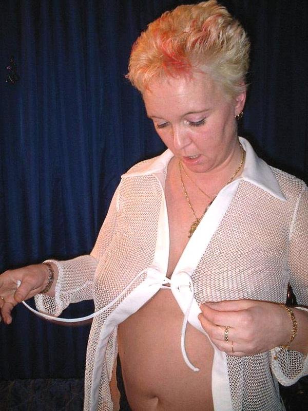 16P Horny granny in stockings plays with her natural big tits