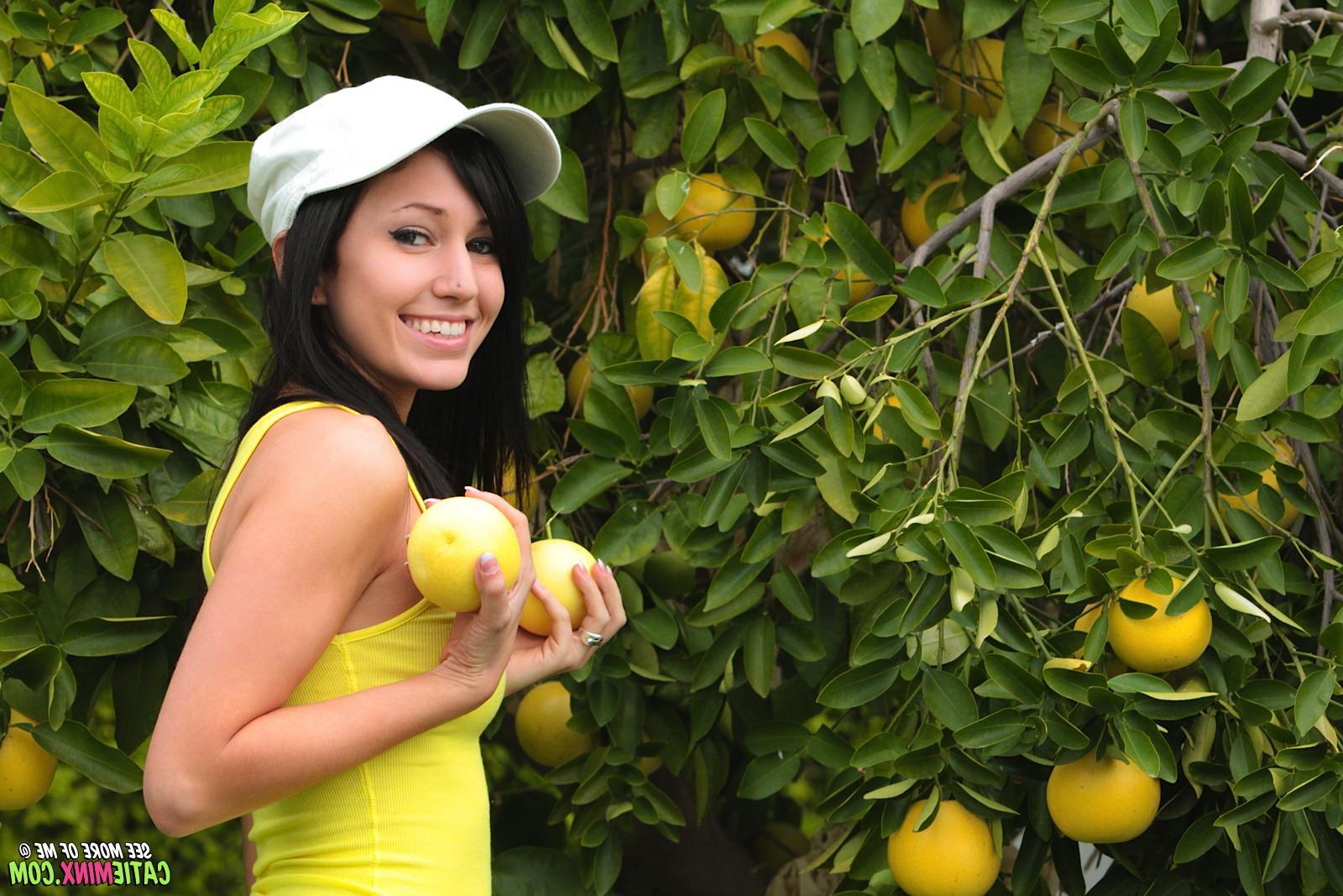 15P Petite teen girl Catie Minx outside at an orchard nude doing splits on the grass