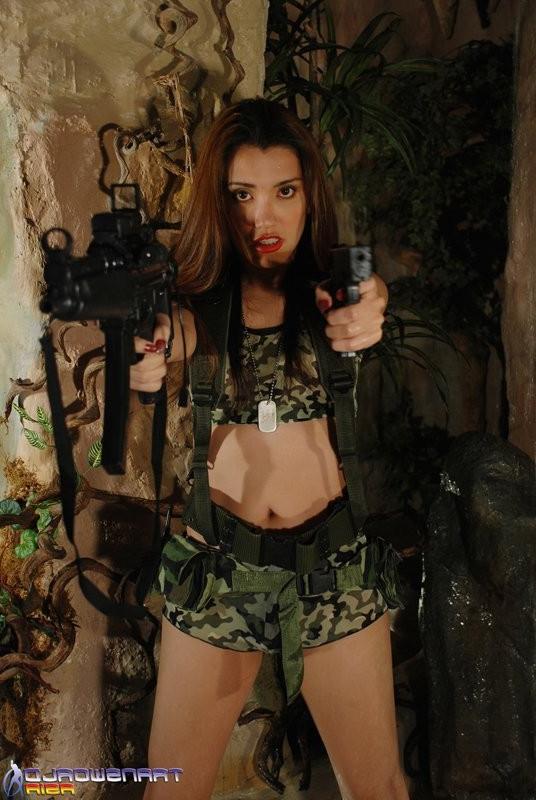 15P Unreal Asian Ladyboy In Skimpy Camouflage Attire Shows Her Cock