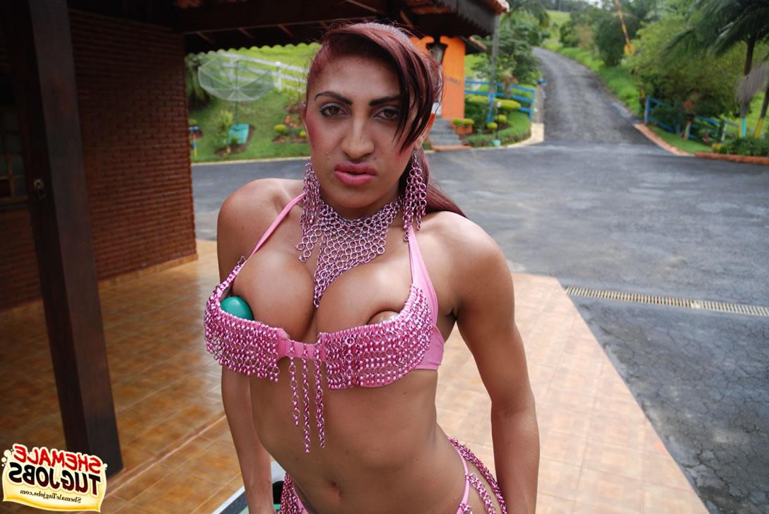 11P Tattooed Indian shemale in a thong plays with her cock on pool t