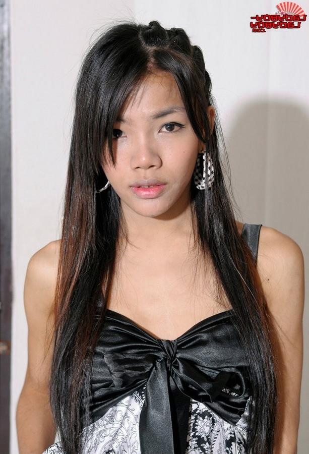15P Petite Asian Ladyboy Spreads Her Legs Wide On The Bed