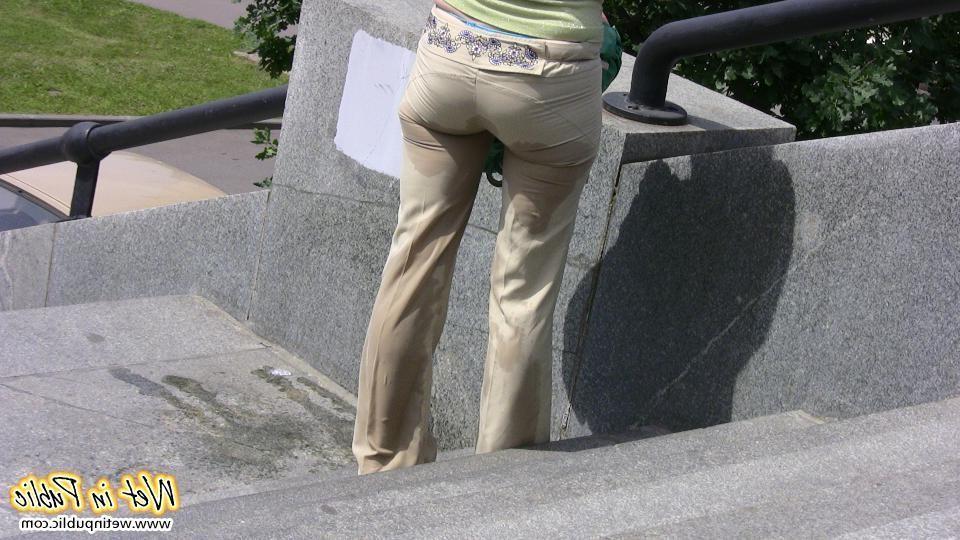 12P Red-haired gal wets her pants and takes a pissing tour around the city