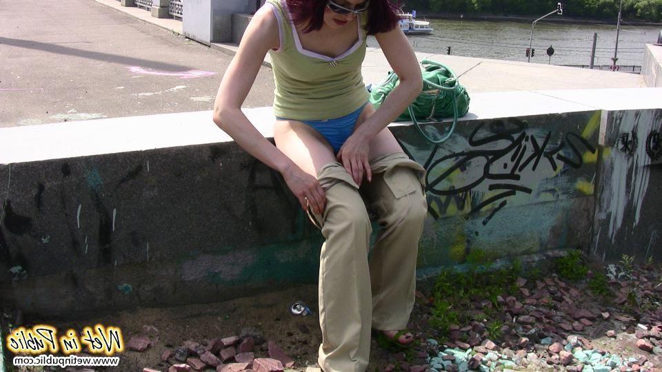 12P Red-haired gal wets her pants and takes a pissing tour around the city
