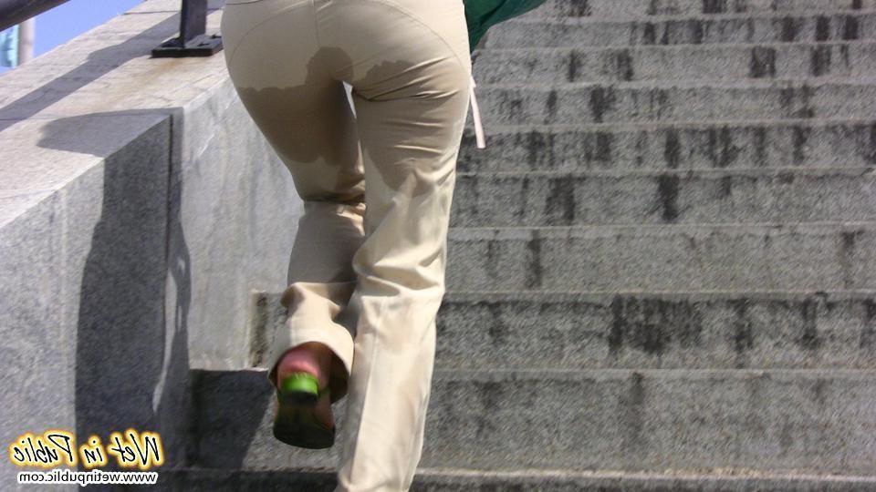12P Red-haired gal wets her pants and takes a pissing tour around the city