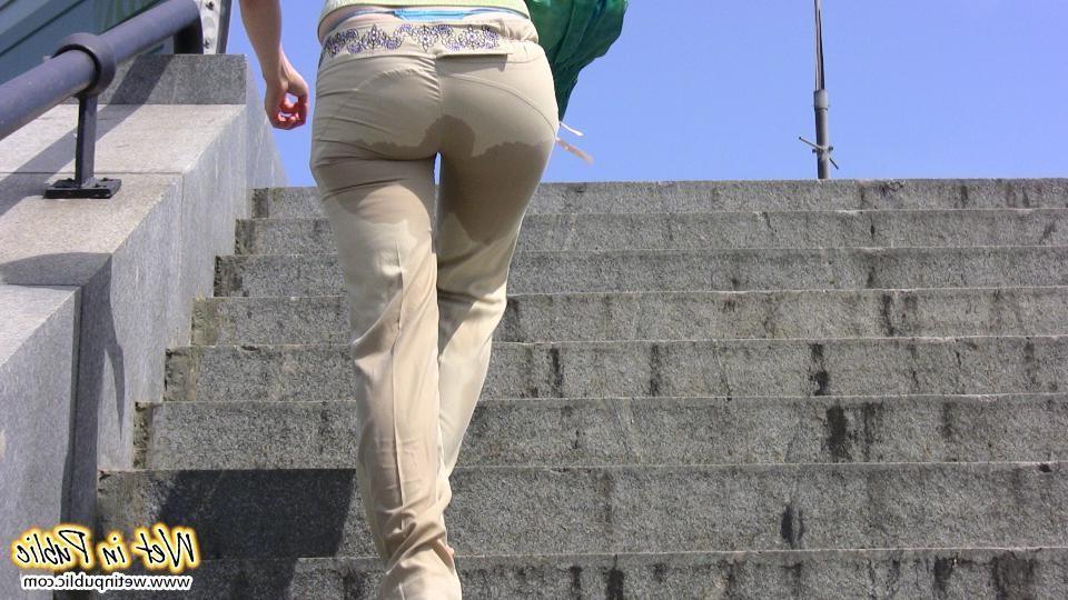12P Red-haired gal wets her pants and takes a pissing tour around the city