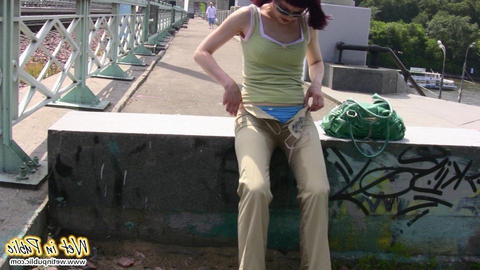 12P Red-haired gal wets her pants and takes a pissing tour around the city