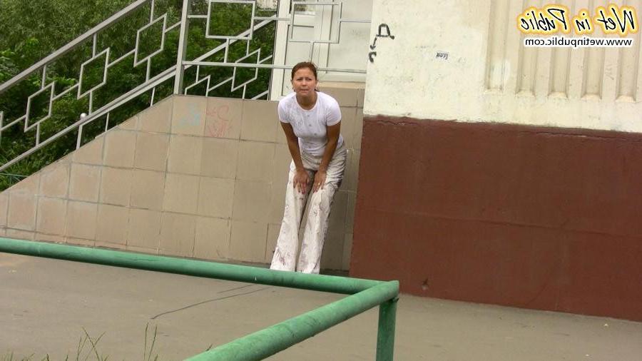 12P Confused babe desperately tries to hide her public pissing disgrace