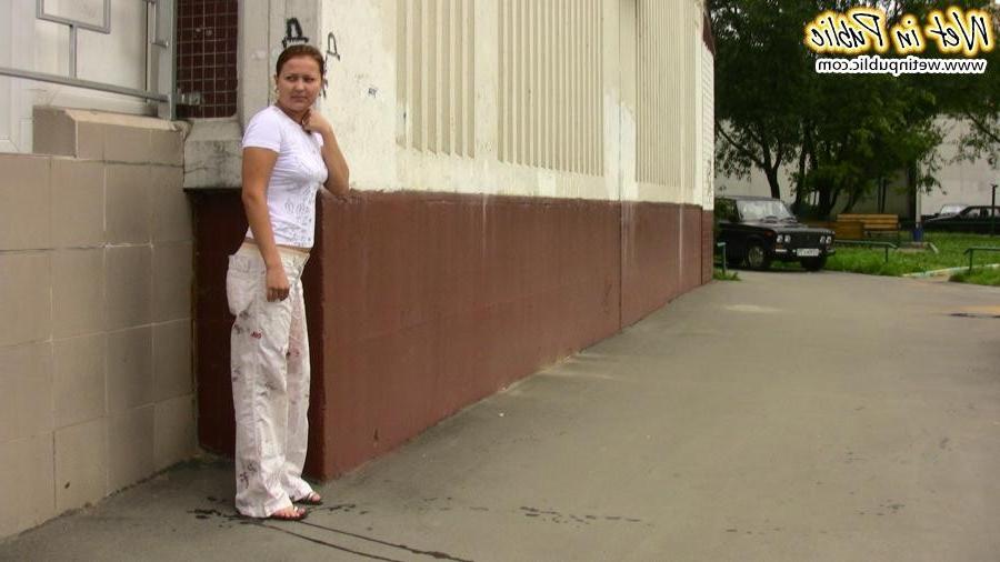 12P Confused babe desperately tries to hide her public pissing disgrace