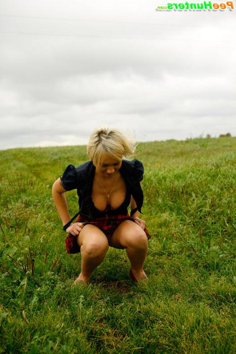 16P Gorgeous busty blonde filmed pissing on a field
