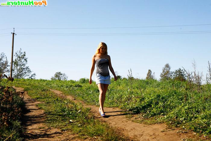 16P Cute teeny pissing in the middle of the country road