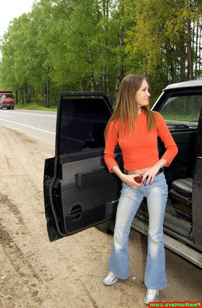 15P Handsome girl peeing near her car after long trip