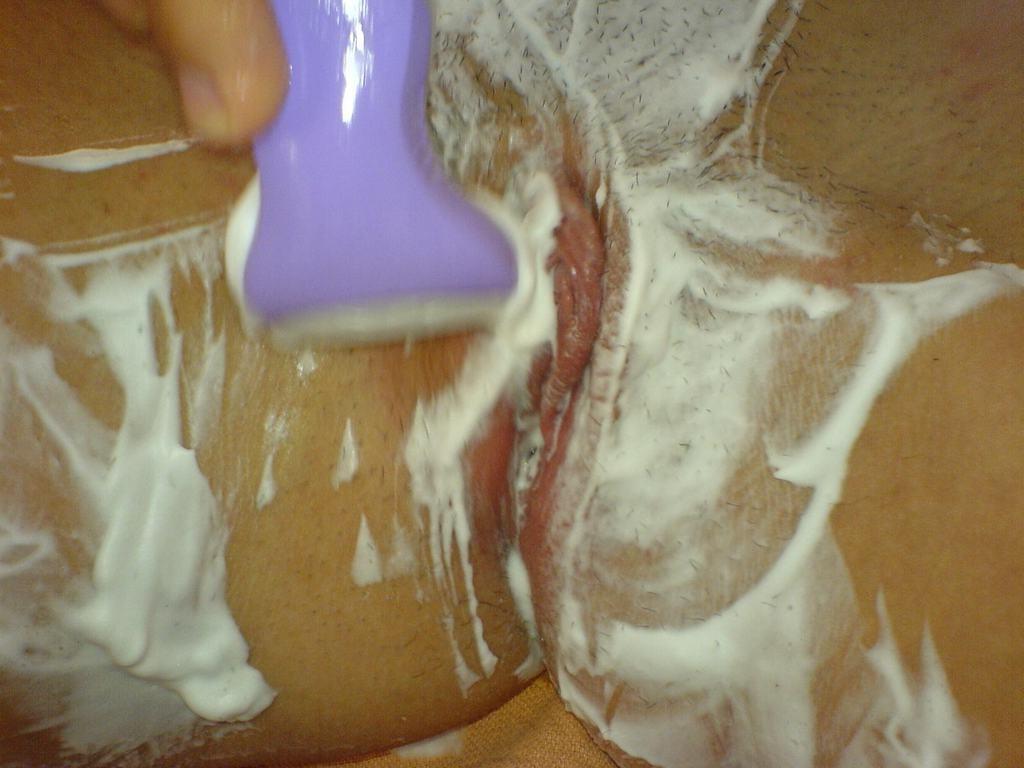 15P Real amateur GF shaves hairy pussy in the shower in homemade pix