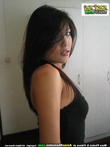 15P Feminine asian ladyboy strips and shows her cock